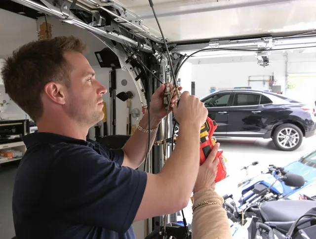 West Whittier-Los Nietos Garage Door Repair safety certified technician performing cable replacement in West Whittier-Los Nietos